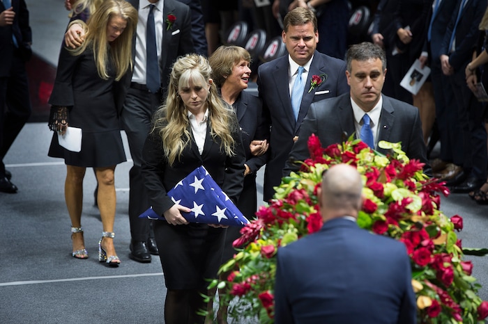 Scott Sommerdorf | The Salt Lake Tribune
Karen Huntsman, center, follows the casket of her husband, Jon M. Huntsman, while walking alongside her son Mark while followed by Christena Huntsman Durham, at left after the funeral services for Jon M. Huntsman, Sr., Saturday, February, 10, 2018. 
