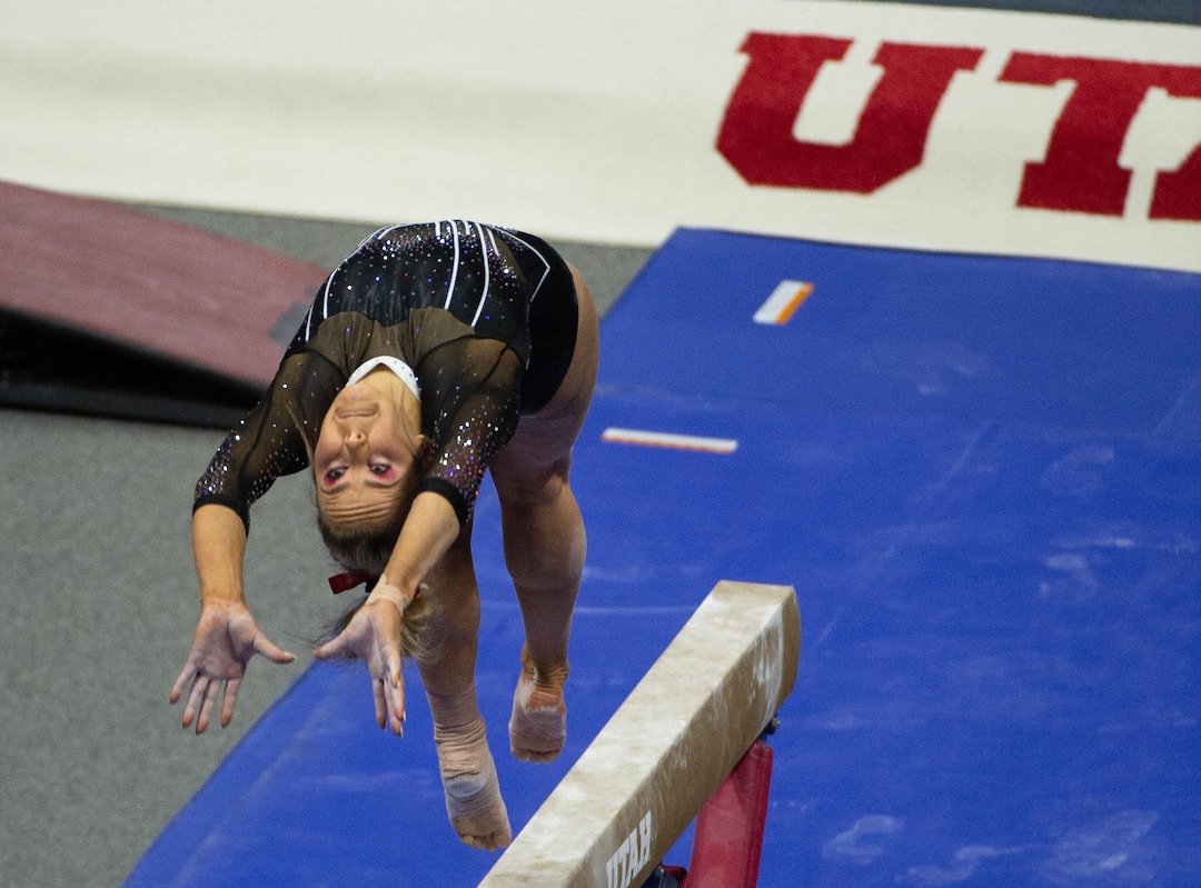 (Francisco Kjolseth  | The Salt Lake Tribune) Adrienne Randall performs on the balance beam in PAC-12 gymnastics action Utah vs UCLA, at the Huntsman Center on Friday, Feb. 19, 2021.