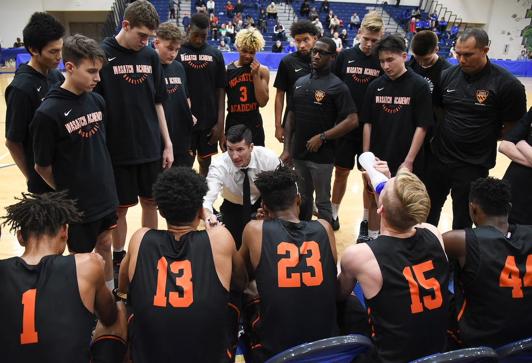 (Francisco Kjolseth  |  The Salt Lake Tribune)  Wasatch Academy head coach David Evans gathers his team during a time out during their game against South County High during a recent tournament at Orem High. 