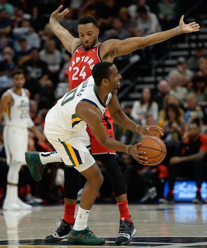 (Francisco Kjolseth  |  The Salt Lake Tribune)  Utah Jazz guard Alec Burks (10) looks for an opening past Toronto Raptors forward Norman Powell (24) in the second half of the preseason NBA game at Vivint Smart Home Arena Tuesday, Oct. 2, 2018, in Salt Lake City.