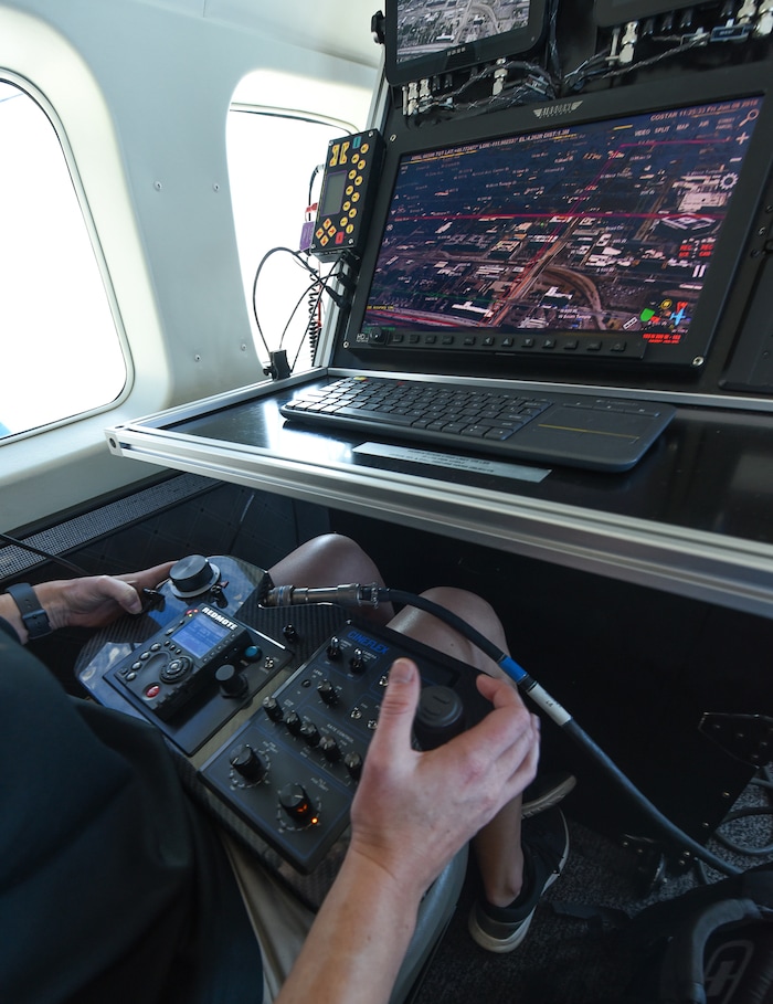 (Francisco Kjolseth  |  Francisco Kjolseth)  Amber Surrency, an aerial research photographer for CoStar Group Inc., documents downtown Salt Lake City on Friday, June 8, 2018, from the air of a specially equipped Cessna Grand Caravan EX. CoStar Group Inc., a research and technology company provides information to commercial real estate professionals, including those in Utah.