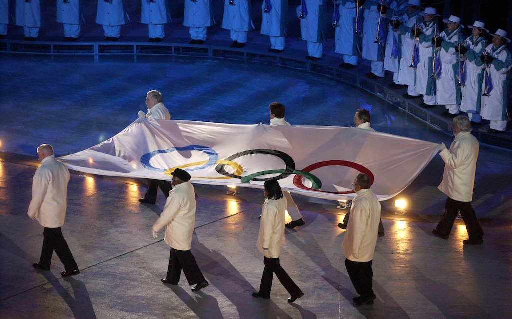 The Olympic flag is brought in during opening ceremonies at Rice Eccles Stadium   Francisco Kjolseth/The Salt Lake Tribune