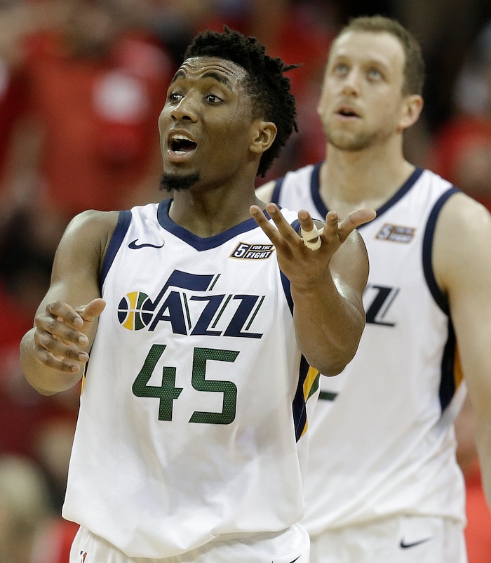 Utah Jazz guard Donovan Mitchell (45) reacts after a Jazz foul during the second half in Game 2 of the team's NBA basketball second-round playoff series against the Houston Rockets, Wednesday, May 2, 2018, in Houston. (AP Photo/Eric Christian Smith)