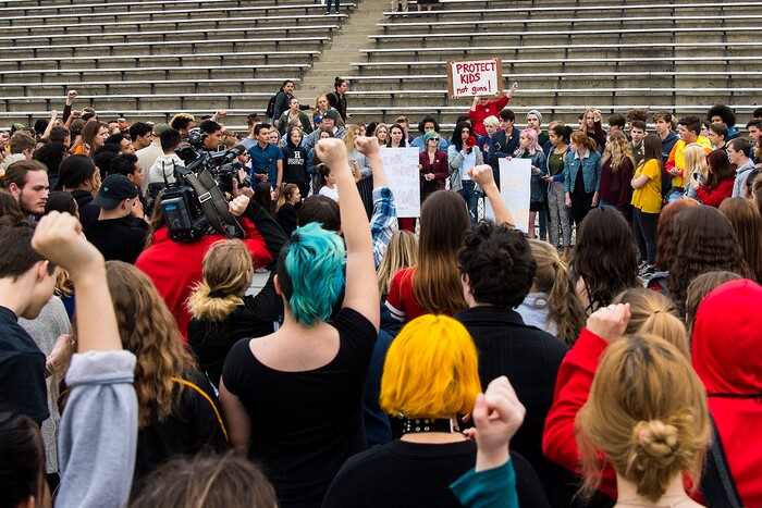 (Chris Detrick  |  The Salt Lake Tribune)  Students at Highland High School in Salt Lake City gather on the football field to participate in a nationwide demonstration for better gun safety laws Thursday, March 15, 2018. Students at more than 30 schools along the Wasatch Front, nearly all of them high schools, particiapted in the 17-minute walkout — one minute for each of the Florida students killed.