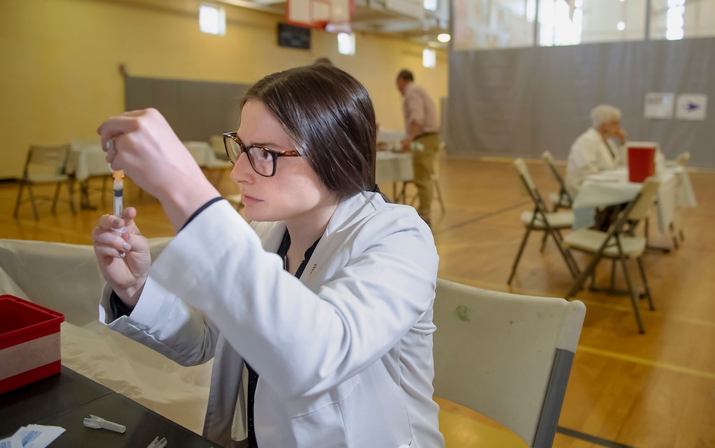 FILE - In this Wednesday, May 8, 2019 file photo, University of Pittsburgh pharmacy student Alexandria Taylor prepares syringes during a free measles vaccination clinic by the Allegheny County Health Department at the Homewood-Brushton YMCA in Pittsburgh. On Monday, May 13, 2019, U.S. health officials say the year’s count of measles cases has surpassed 800, in a growing tally that already is the nation’s highest in 25 years. (Steph Chambers/Pittsburgh Post-Gazette via AP)