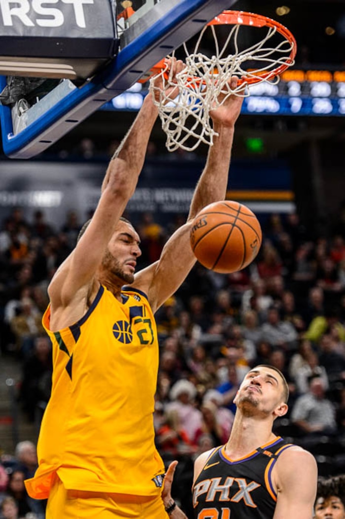 (Trent Nelson | The Salt Lake Tribune)  Utah Jazz center Rudy Gobert (27) dunks on Phoenix Suns center Alex Len (21) as the Utah Jazz host the Phoenix Suns, NBA basketball in Salt Lake City, Wednesday Feb. 14, 2018.
