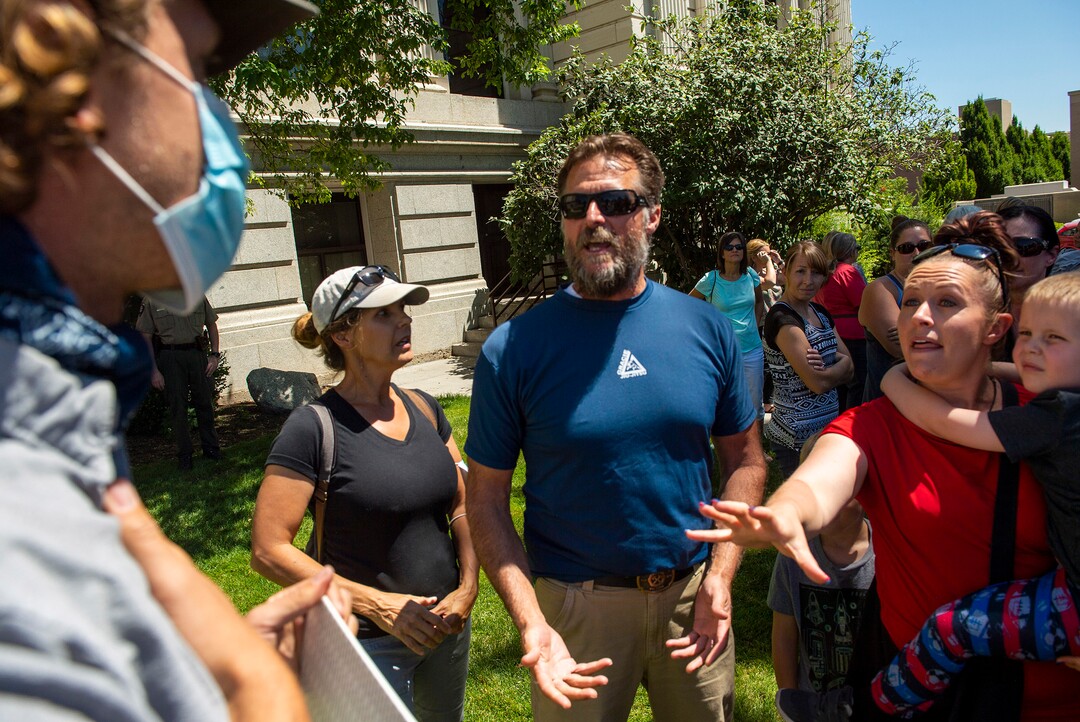 (Rick Egan  |  The Salt Lake Tribune)   Residents shout at Clark Goldsberry, a high school teacher at American Fork High School, because he was wearing a mask, during a rally protesting against masks being required in schools, before the Utah County Commission meeting in Provo, on Wednesday, July 15, 2020.