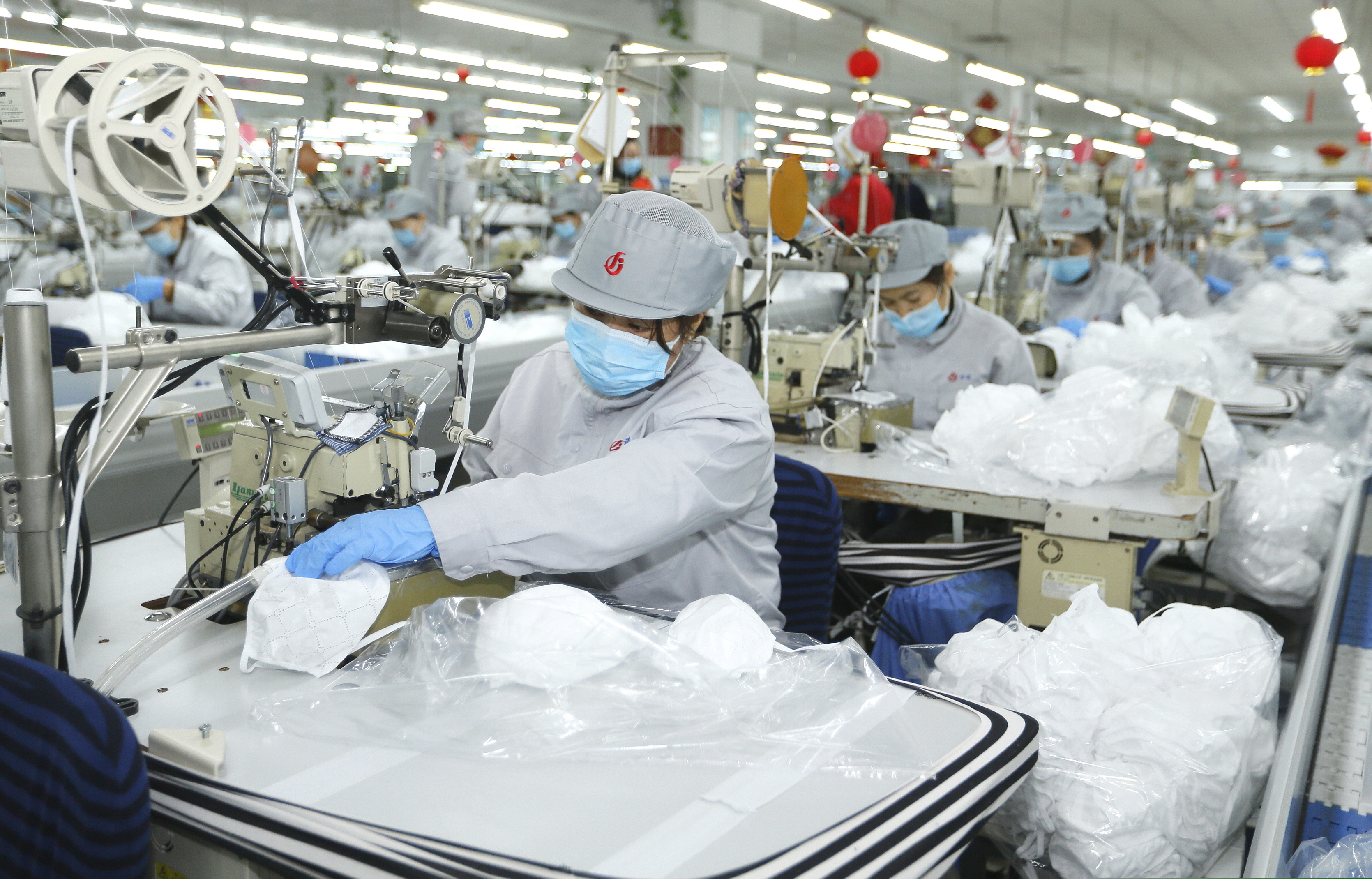 (Liang Xiaopeng | Xinhua via AP file photo) Workers produce face masks in the workshop of a textile company in Jimo District of Qingdao in eastern China's Shandong Province on Wednesday, Feb. 12, 2020. Qingdao Municipal Bureau of Industry and Information Technology has mobilized two large textile companies to produce face masks to help the fight against the novel coronavirus epidemic.