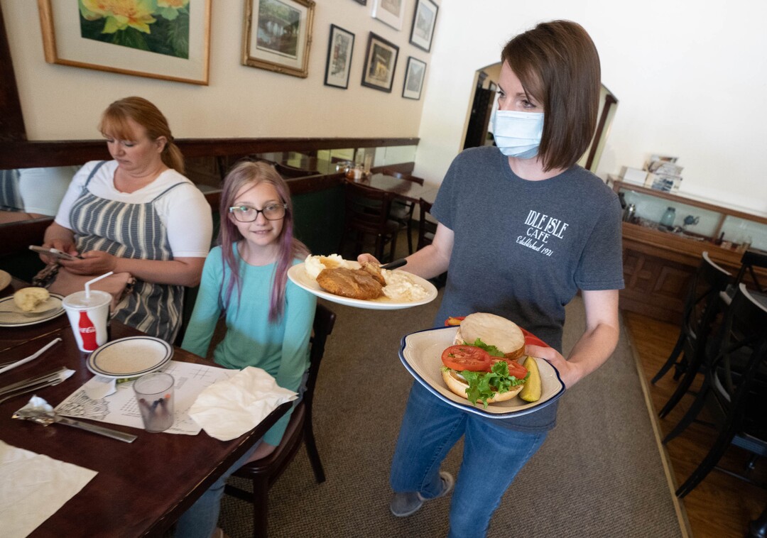 (Francisco Kjolseth | The Salt Lake Tribune) Jana Porter, co-owner of Idle Isle Cafe in Brigham City delivers an order at the popular restaurant on Friday, May 14, 2021.