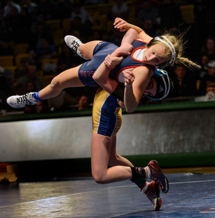 (Steve Griffin  |  The Salt Lake Tribune) Kierstien Bush, of Bonneville, arches her back and throws Sage Mortimer, of ALA, to the mat during the All-Star Duals wrestling at Utah Valley University's UCCU Center in Orem Tuesday January 9, 2018.