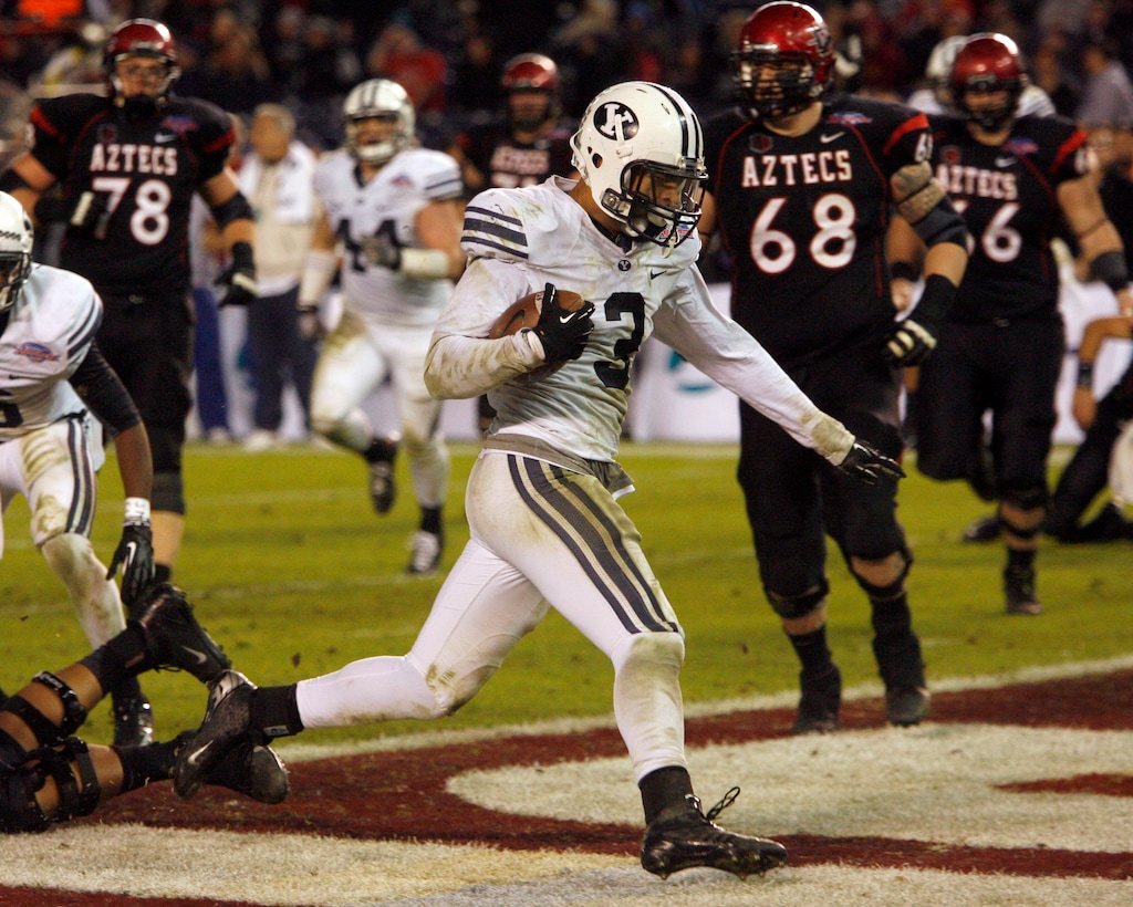 (Rick Egan | Tribune file photo) Brigham Young linebacker Kyle Van Noy (3) scores a touchdown for cougars, after intercepting a pass, as BYU defeated San Diego State 23-6 in the Poinsettia Bowl, Thursday, December 20, 2012.
