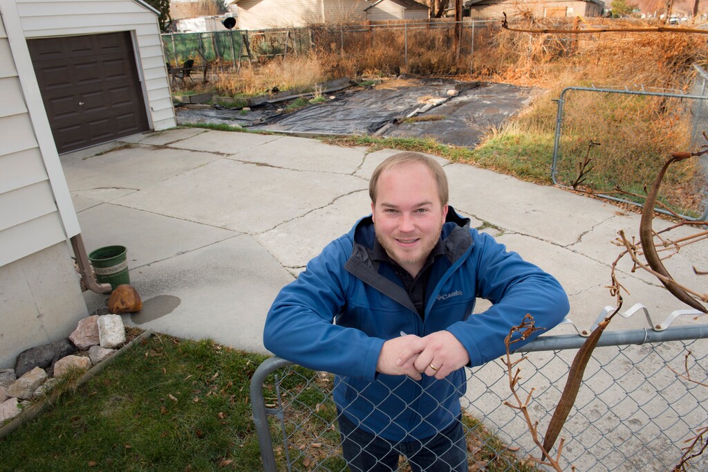 (Scott Sommerdorf   |  The Salt Lake Tribune)   The City Council is enacting changes to allow new accessory dwellings to be built in parts of the city. John Armstrong, who spoke in favor of them on behalf of his mother at this week's council meeting, hopes to build one on her property. He poses next to her home near the site of the proposed dwelling, Saturday, December 2, 2017.  