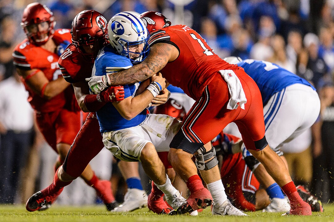 (Trent Nelson | The Salt Lake Tribune)  Utah Utes linebacker Cody Barton (30) sacks Brigham Young Cougars quarterback Tanner Mangum (12) as BYU hosts Utah, NCAA football in Provo, Saturday September 9, 2017.