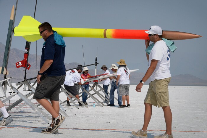 (Scott Sommerdorf   |  The Salt Lake Tribune)   Jamie and Brett Borget bring back David Spencer's rocket after a failed launch at HellFire, sponsored by the Utah Rocket Club, Saturday, August 5, 2017. Some adjustments were made, and the rocket later was successfully launched.