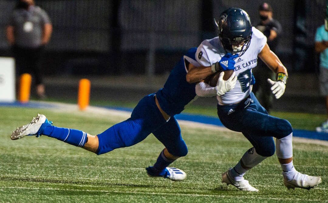 (Rick Egan  |  The Salt Lake Tribune)   Noah Kjar runs the ball for Corner Canyon, in prep action between the Bingham Miners and the Corner Canyon Chargers, at Bingham High onFriday, Aug. 28, 2020.