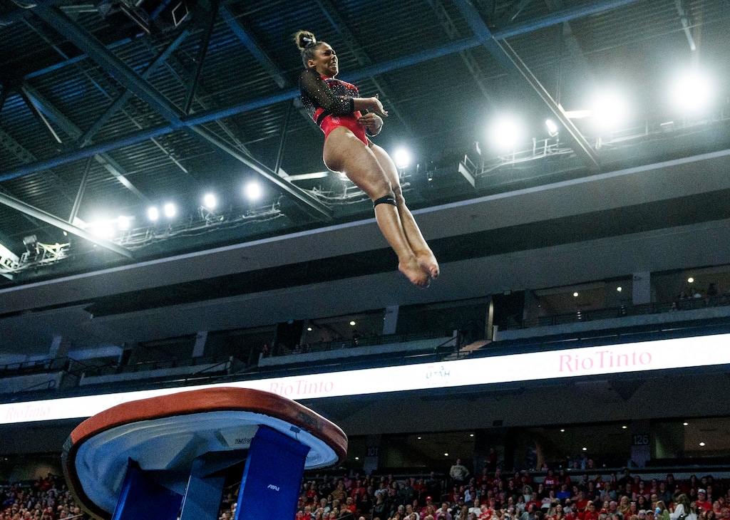 (Leah Hogsten | The Salt Lake Tribune) Jaedyn Rucker performs on vault during the fourth-annual Rio Tinto Best of Utah gymnastics meet between Brigham Young University, Southern Utah University, Utah State University and the University of Utah at the Maverik Center, Jan. 13, 2023. Rucker received a 9.925.