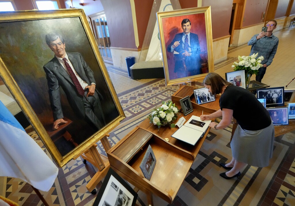 (Francisco Kjolseth  |  The Salt Lake Tribune) Salt Lake County Mayor Jenny Wilson signs a memory book for her father, former Salt Lake City Mayor Ted Wilson, at Salt Lake City Hall on Monday, April 15, 2024.