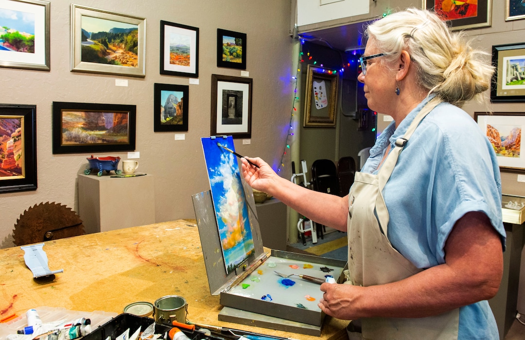 (Rick Egan  |  The Salt Lake Tribune)        Diane Walsh paints in the Artisans Art Gallery in Cedar City, Wednesday, June 19, 2019.