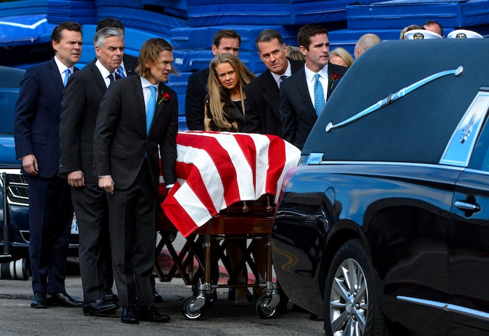 (Steve Griffin  |  The Salt Lake Tribune)  Jon Huntsman's children and family members carry his casket following funeral services at the Huntsman Center on the University of Utah campus in Salt Lake City Saturday February 10, 2018.