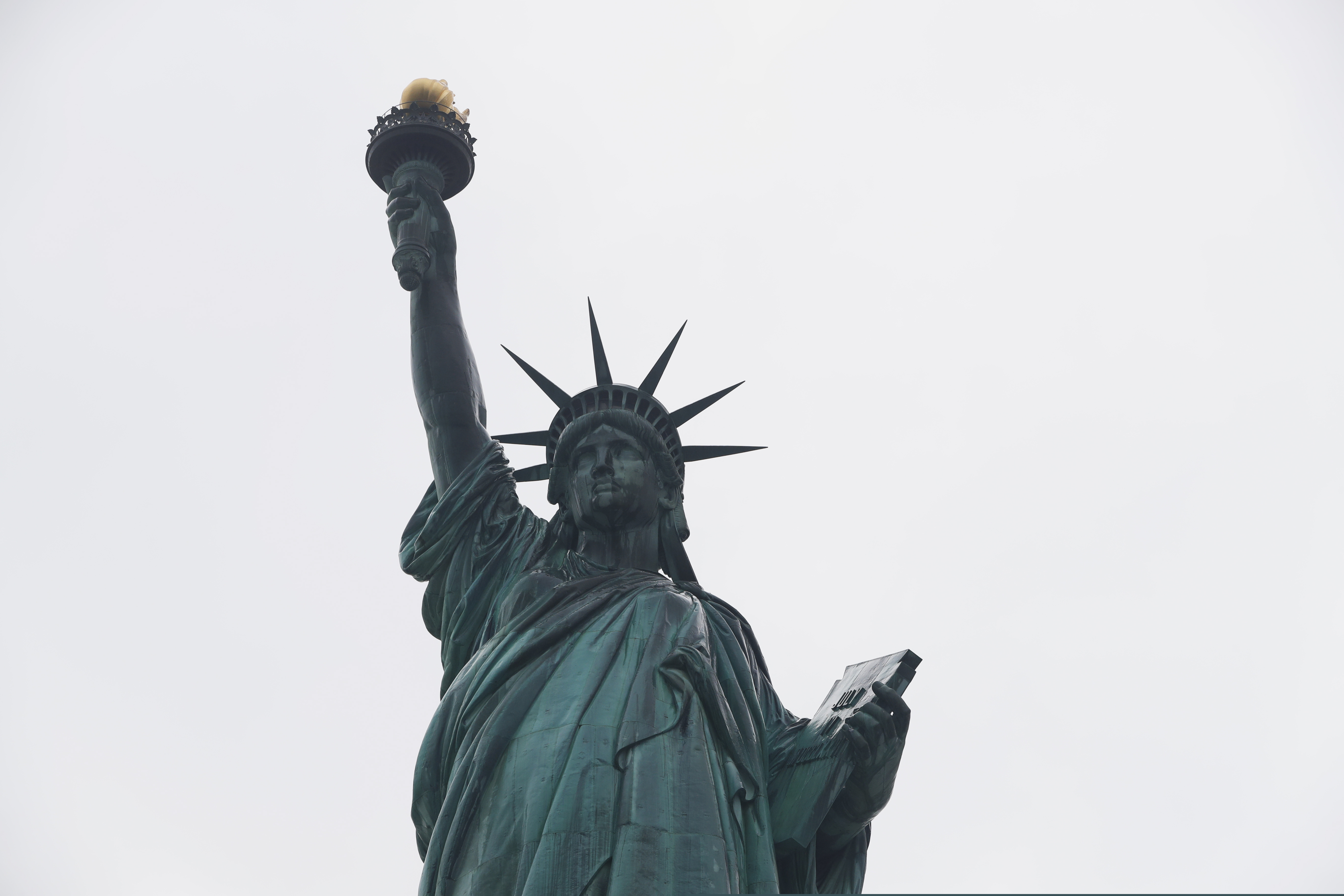 (Kathy Willens | AP) The Statue of Liberty wields her torch, Wednesday, Aug. 14, 2019, on a cloudy day in New York.