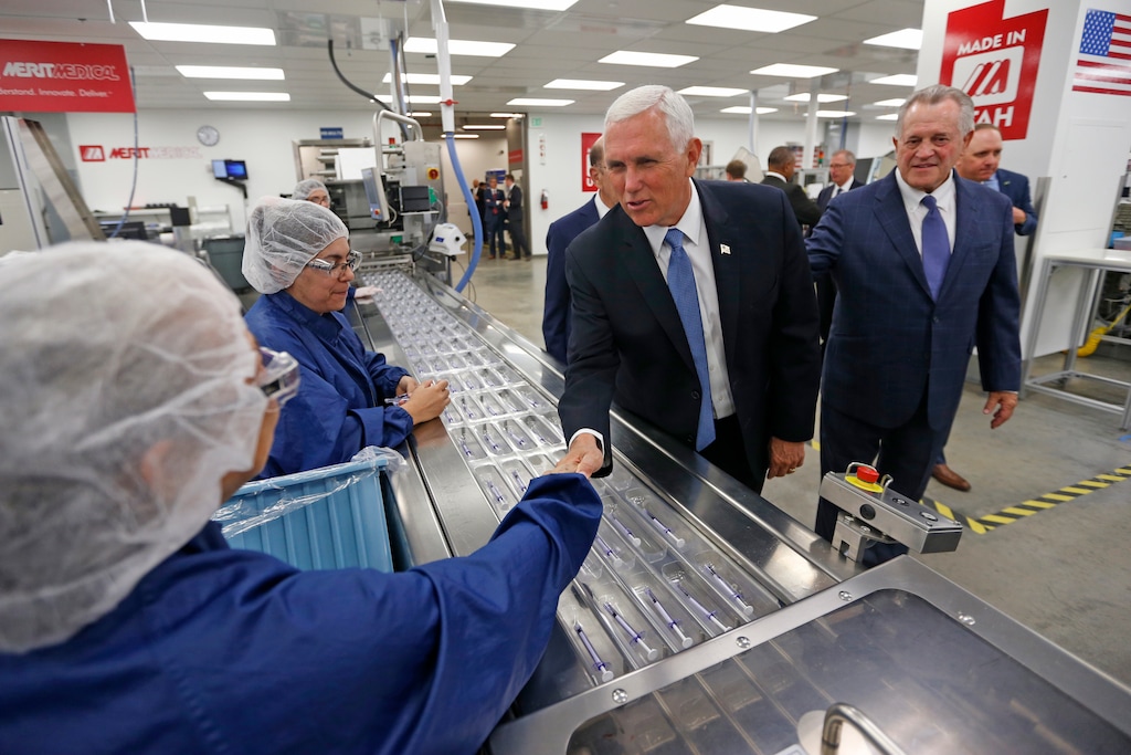 Vice President Mike Pence tours medical-device manufacturer Merit Medical with Fred Lampropoulos, Merit Medical chairman and CEO, Thursday, Aug. 22, 2019, in South Jordan, Utah. Pence is visiting Utah as the next stop on a trip to promote the Trump administration’s trade deal with Mexico and Canada. (AP Photo/Rick Bowmer, Pool)