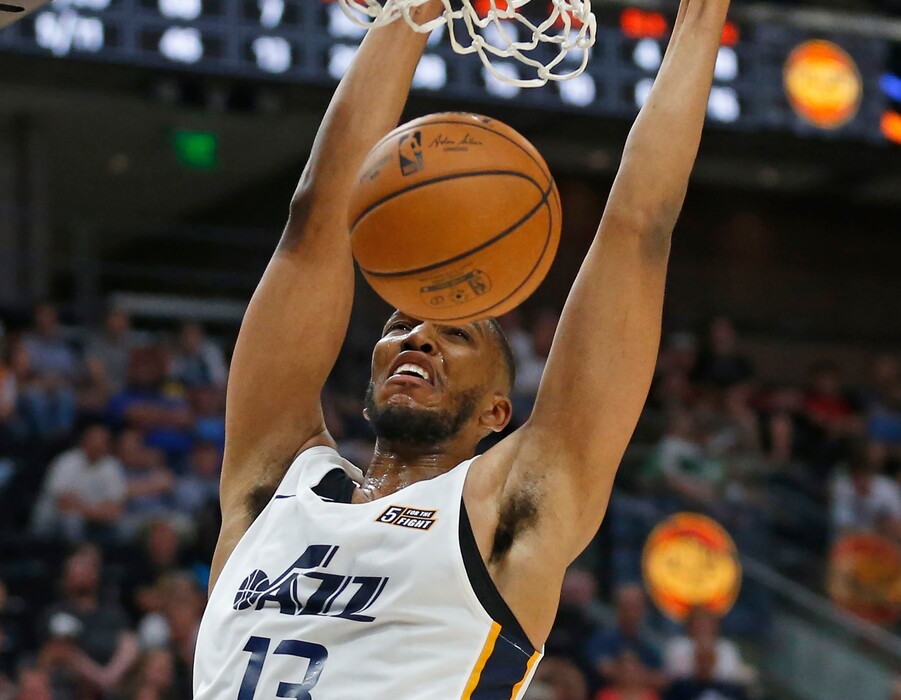 Utah Jazz's Tony Bradley (13) dunks the ball against the Memphis Grizzlies during the second half of an NBA summer league basketball game Monday, July 1, 2019, in Salt Lake City. (AP Photo/Rick Bowmer)