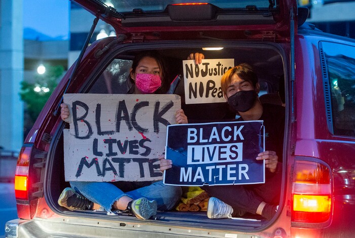 (Rick Egan  |  The Salt Lake Tribune)     Protesters follow the matchers in cars as they chant slogans from their cars on State Street, Monday, June 1, 2020.