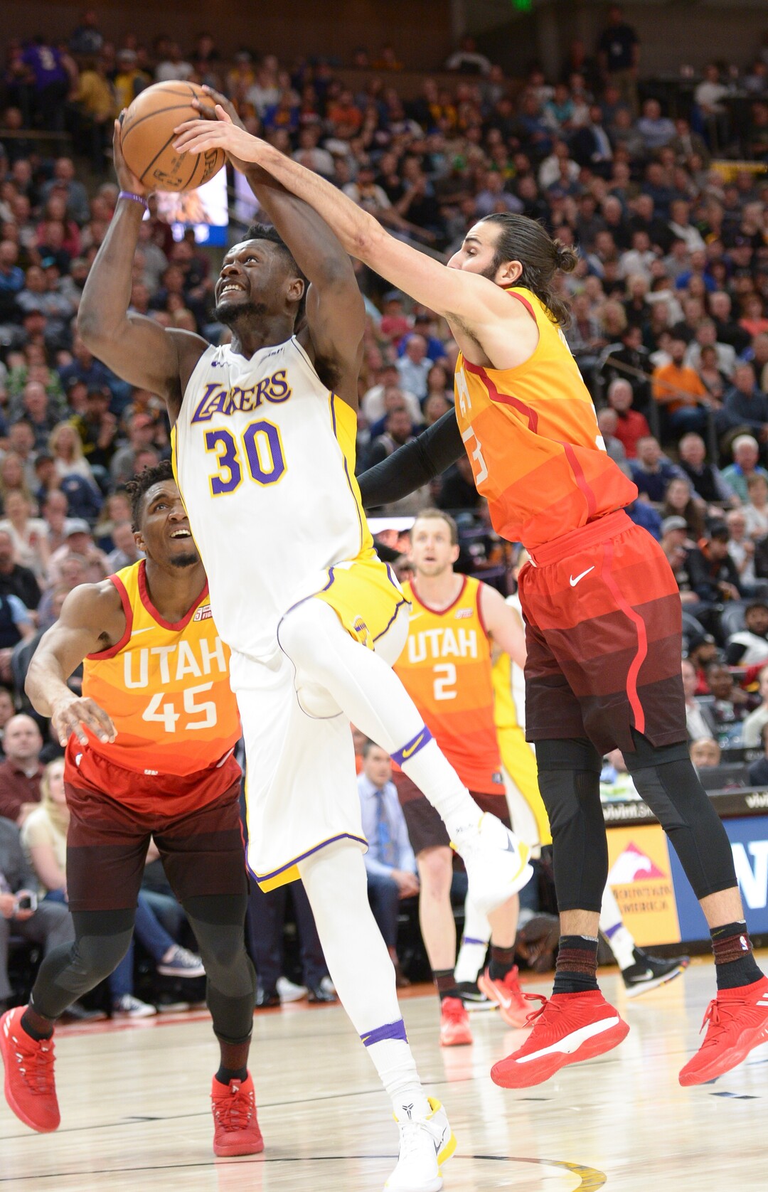 (Leah Hogsten  |  The Salt Lake Tribune)  Utah Jazz guard Ricky Rubio (3) fouls Los Angeles Lakers forward Julius Randle (30).  The Utah Jazz defeated the Los Angeles Lakers 117-110 at Vivint Smart Home Arena Tuesday, April 3, 2018