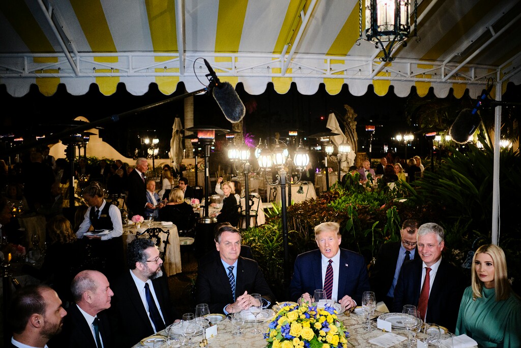 (T.J. Kirkpatrick | The New York Times) President Donald Trump hosts President Jair Bolsonaro of Brazil, center left, during a dinner at his Mar-a-Lago estate in Palm Beach, Fla., March 7, 2020. Trump will not be tested for the coronavirus after coming into contact with a Brazilian official who tested positive for the virus just days after participating in meetings with him in Florida, the White House said on Thursday.