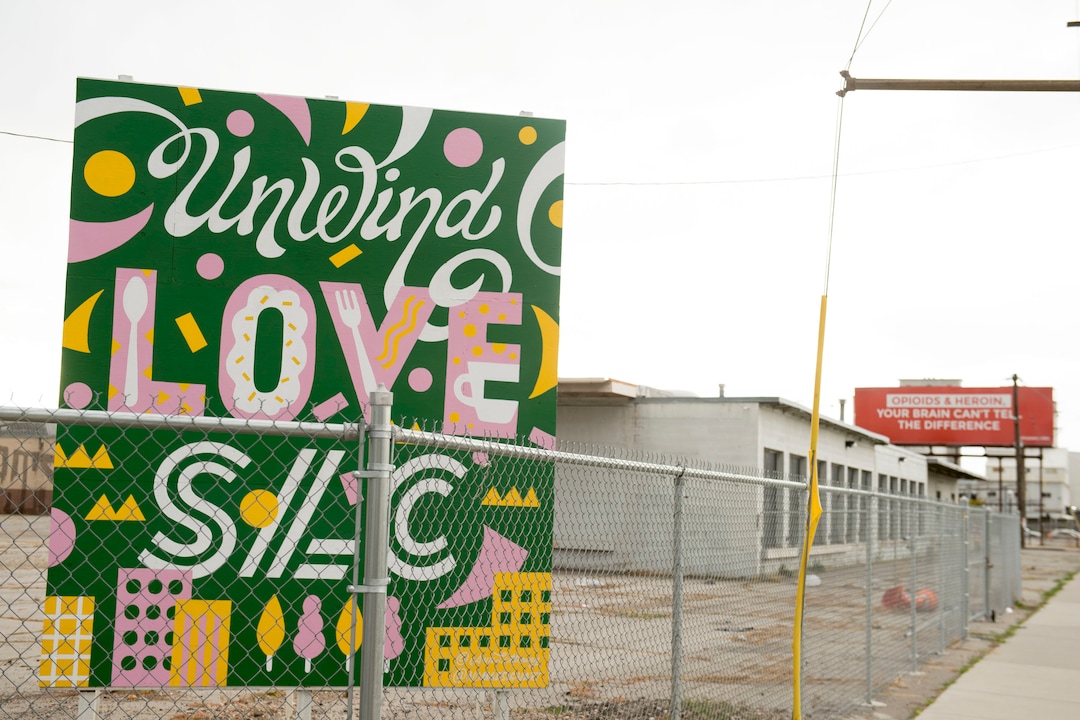 (Jeremy Harmon  |  The Salt Lake Tribune) A colorful sign alludes to things to come as developers plan to remake a 12.4-acre area just west of downtown Salt Lake City. The development, called Post District, is mostly comprised of the block between 300 and 400 West and 500 and 600 South. Photographed on Thursday, Oct. 17, 2019.