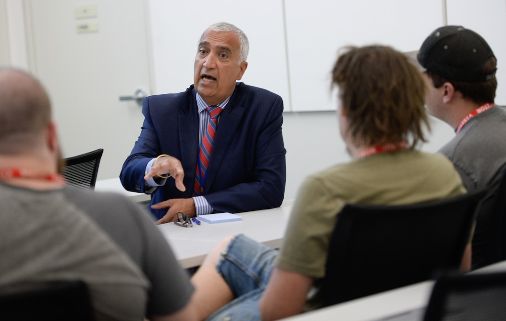 (Francisco Kjolseth | The Salt Lake Tribune) District Attorney Sim Gill speaks with organizers from Utah Against Police Brutality (UAPB) during a sit down meeting at his office on Monday, Oct. 1, 2018, where he discusses his decision to not file charges against a West Valley officer who shot and killed Elijah Smith. The decision has been widely criticized and rejected by UAPB.
