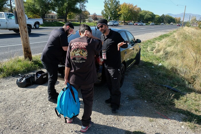 (Francisco Kjolseth  |  The Salt Lake Tribune)  Alex Larson, left, and Patrick Rezac, right, Executive Director of One Voice Recovery, check in with Ivan Vasquez, 58, who is homeless and a heroin user in West Salt Lake recently. In an effort to curb the incidents of hepatitis C, HIV and STD's, Rezac's grass roots team hands out disease prevention kits and provides a needle exchange program.