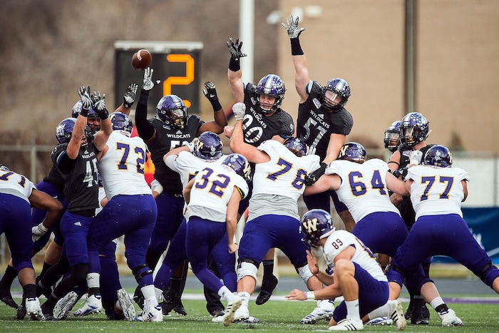 (Chris Detrick  |  The Salt Lake Tribune)  Western Illinois Leathernecks place kicker Sam Crosa (32) kicks a field goal past Weber State Wildcats defense during the game at Stewart Stadium Saturday, November 25, 2017.  