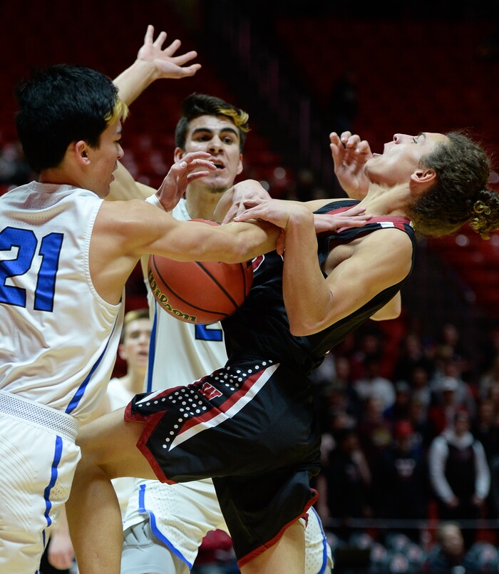 (Francisco Kjolseth  |  The Salt Lake Tribune)  Weber vs Pleasant Grove, 6A State high school basketball tournament at the Huntsman Center in Salt Lake City, Thursday March 1, 2018. Pleasant Grove's Kawika Akina (21) puts the brakes on Hudson Schenck (3). 