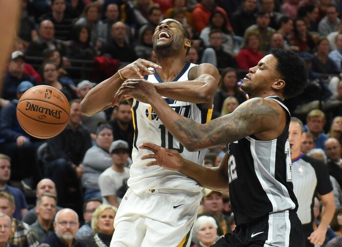 (Francisco Kjolseth  |  The Salt Lake Tribune)  Utah Jazz guard Alec Burks (10) is pressured by San Antonio Spurs forward Rudy Gay (22) during the first quarter of an NBA basketball game in Salt Lake City, Thursday, Dec. 21, 2017.
