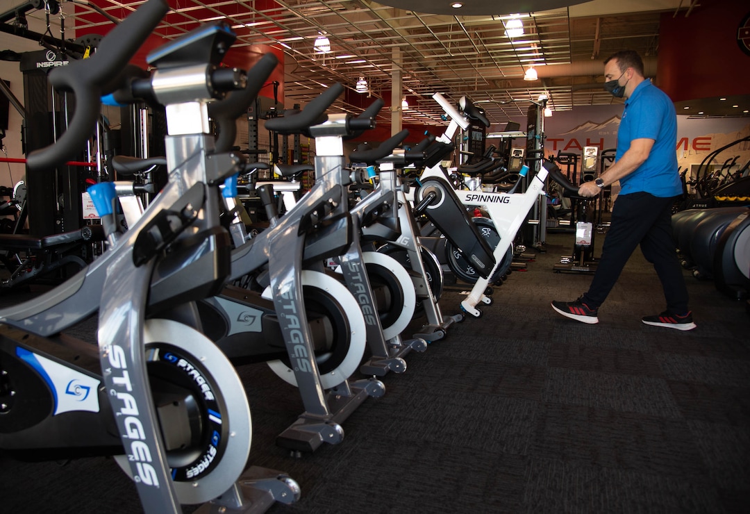 (Francisco Kjolseth  |  The Salt Lake Tribune) Clint Eisinger, operations manager at Utah Home Fitness in Sandy, has seen brisk sales of stationary bikes as the staff takes advantage of a slow moment to catch up on restocking inventory on Wednesday, Oct. 22, 2020. Home fitness equipment sales boomed in March and April when gyms closed because of the coronavirus. Everything from inexpensive dumbbells to premium treadmills and ellipticals were wiped out of stores and warehouses. Record sales continue throughout the summer — normally the slow time for the industry, and store owners expect sales to remain high during the holidays.