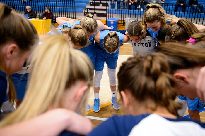 (Trent Nelson | The Salt Lake Tribune)  Layton players pray before tipoff as Layton faces Copper Hills in the 6A High School Girls' Basketball Tournament at SLCC in Taylorsville, Thursday Feb. 22, 2018.