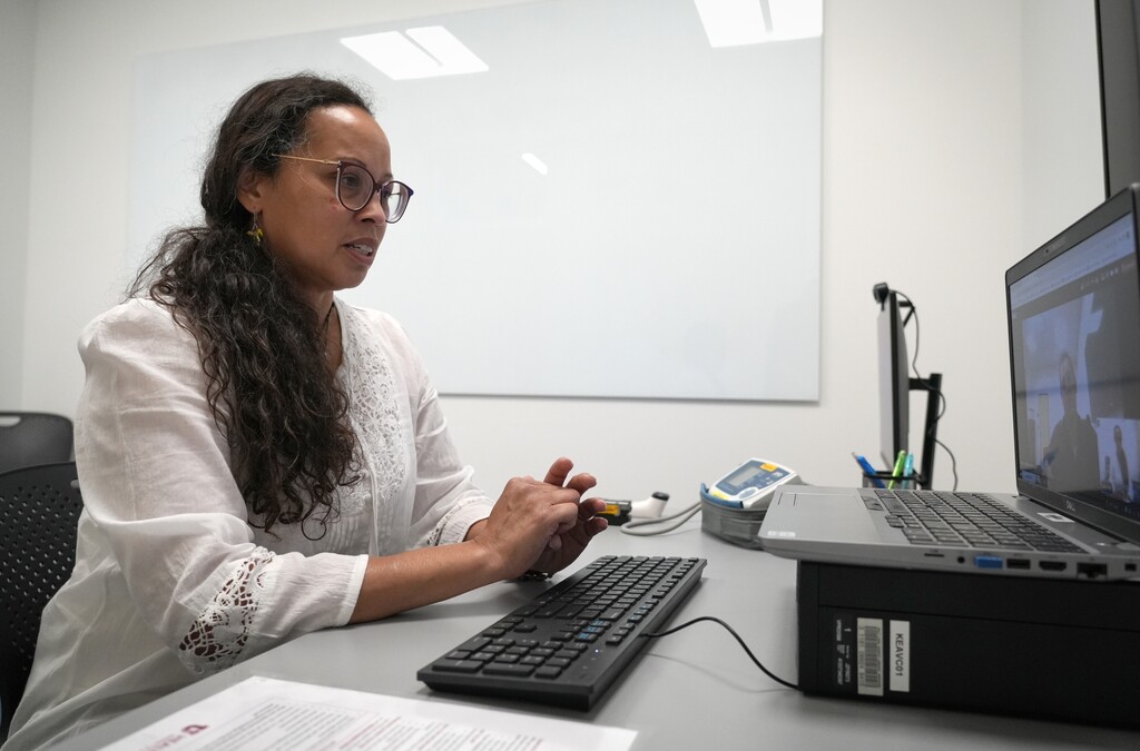 (Bethany Baker | The Salt Lake Tribune) Kearns librarian Vanessa Lindquist demonstrates how the public can utilize the new virtual visit room at Kearns Library on Wednesday, Aug. 30, 2023.