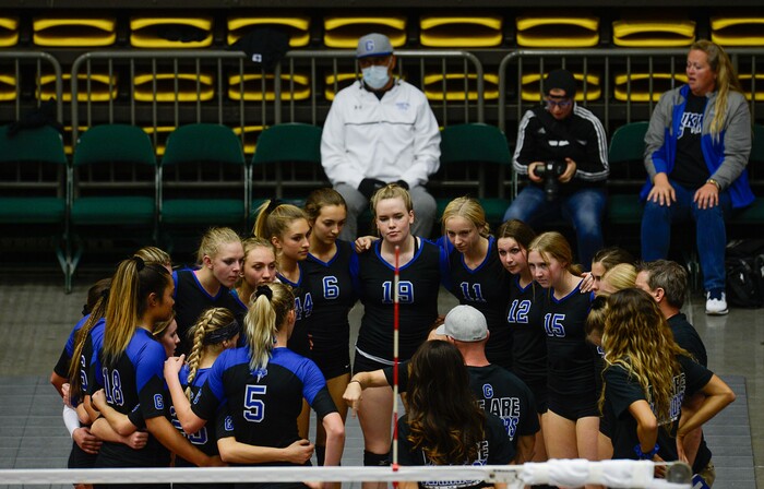(Francisco Kjolseth  |  The Salt Lake Tribune)  Wayne Tarawhiti, in background, supports her daughter Kazna as she plays her quarterfinal match up against Syracuse at the UCCU Center at Utah Valley University on Thursday, Nov. 2, 2017, defeating them in three straight sets. Wayne is battling a form of blood cancer and keeps covered up due to a compromised immune system. 