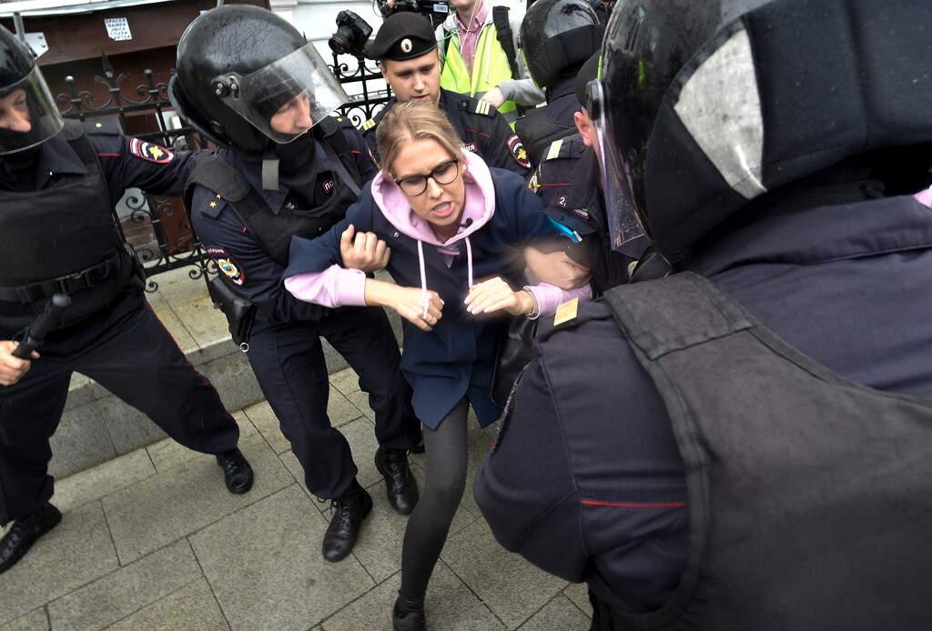 (Dmitry Serebryakov | AP Photo) Police officers detain an opposition candidate and lawyer at the Foundation for Fighting Corruption Lyubov Sobol in the center of Moscow, Russia, Saturday, Aug. 3, 2019. Moscow police detained more than 300 people Saturday who are protesting the exclusion of some independent and opposition candidates from the city council ballot, a monitoring group said.