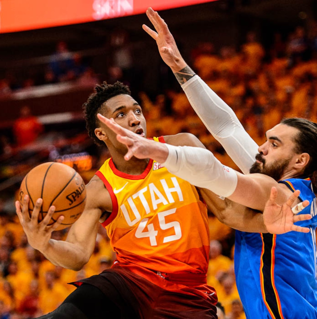 (Trent Nelson | The Salt Lake Tribune)  Utah Jazz host the Oklahoma City Thunder, Game 3, NBA playoff basketball in Salt Lake City, Saturday April 21, 2018. Utah Jazz guard Donovan Mitchell (45) defended by Oklahoma City Thunder center Steven Adams (12).