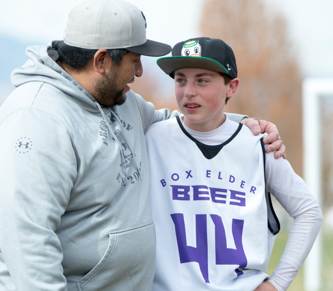 (Rick Egan | The Salt Lake Tribune) Player Seth Linvulle gets a hug from Box Elder lacrosse coach Juan Gaytan during a tournament in Logan on Saturday, Nov. 3, 2018.