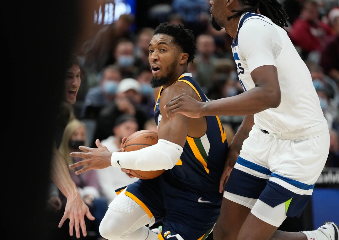 (Francisco Kjolseth | The Salt Lake Tribune) Utah Jazz guard Donovan Mitchell (45) pushes through line of defense in NBA action between the Utah Jazz and the Minnesota Timberwolves at Vivint Smart Home Arena in Salt Lake City, Thursday, Dec. 23, 2021.