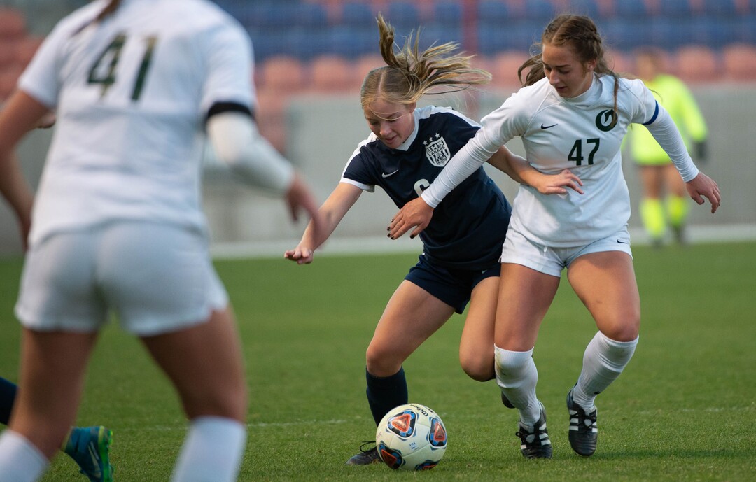 (Francisco Kjolseth  |  The Salt Lake Tribune) Hailee Cherry #6 of Bonneville tries to push past …………..of Olympus as they compete in their 5A high school girls championship game at Rio Tinto Stadium in Sandy on Friday, Oct. 23, 2020. Bonneville went on to win 1-0 in overtime.
