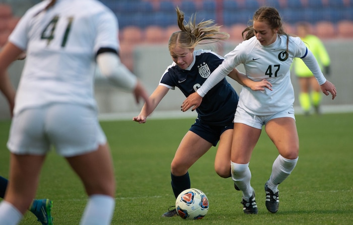 (Francisco Kjolseth  |  The Salt Lake Tribune) Hailee Cherry #6 of Bonneville tries to push past …………..of Olympus as they compete in their 5A high school girls championship game at Rio Tinto Stadium in Sandy on Friday, Oct. 23, 2020. Bonneville went on to win 1-0 in overtime.