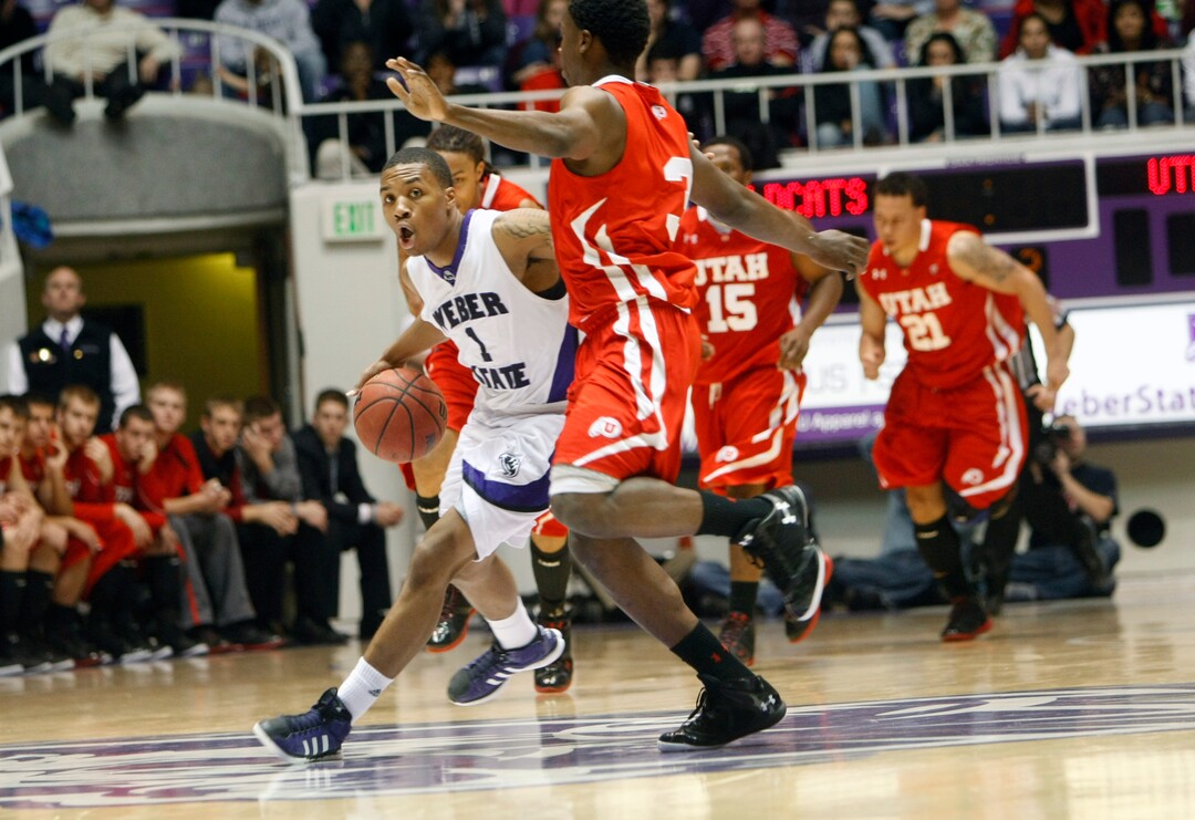 (Chris Detrick  |  Tribune file photo) Weber State Wildcats guard Damian Lillard (1) runs around Utah Utes guard Anthony Odunsi (3) during a 2011 game.