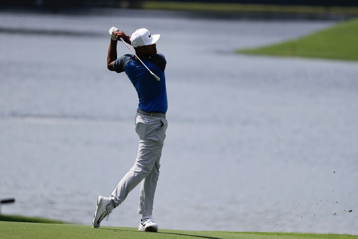 Tony Finau hits from the fairway on the 15th hole during the first round of the PGA Championship golf tournament at the Quail Hollow Club Thursday, Aug. 10, 2017, in Charlotte, N.C. (AP Photo/Chris O'Meara)