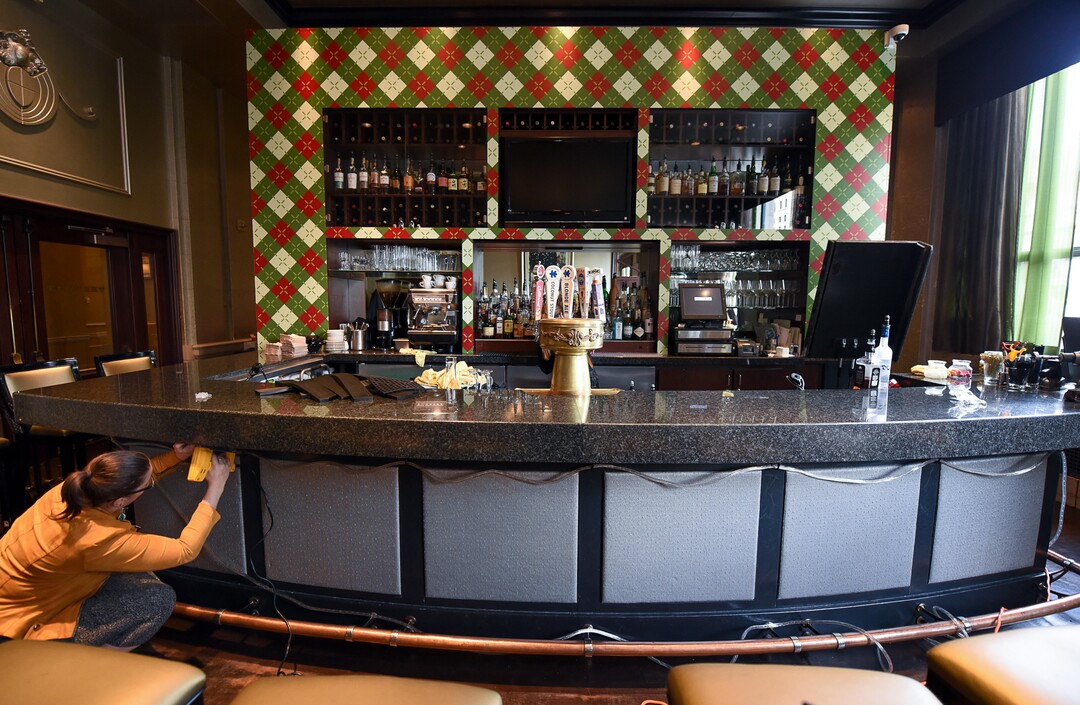 (Francisco Kjolseth  |  The Salt Lake Tribune)  Hotel Monaco employee Ashleigh Gall decorates for the opening of The Miracle Bar — a Christmas themed pop-up with holiday drinks and decorations.