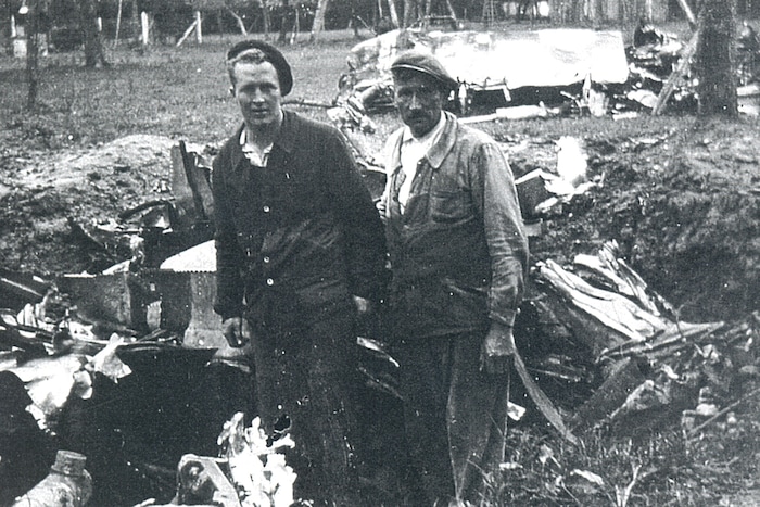 (Courtesy of the Imperial War Museum and the Lonnie Moseley family) Lonnie Moseley, left, stands at the crash site of his P-47 Thunderbolt fighter plane in 1944.