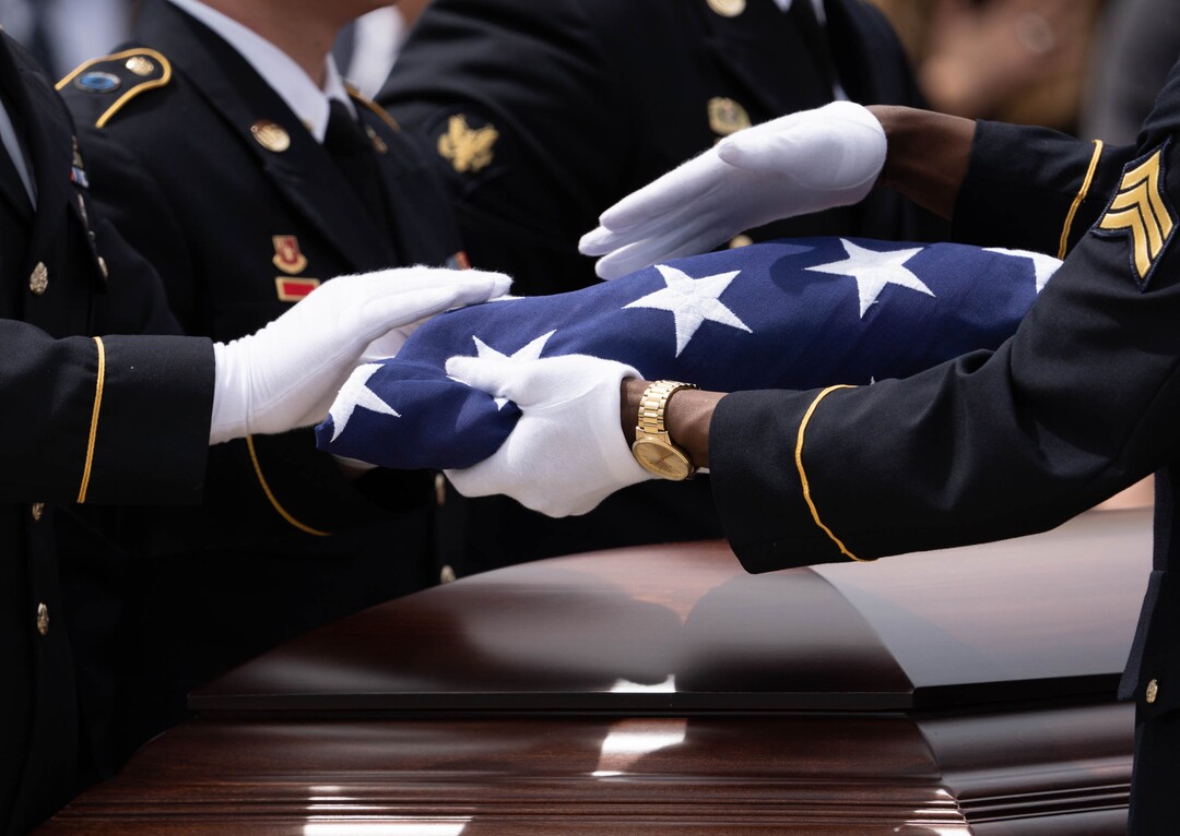 (Francisco Kjolseth | The Salt Lake Tribune) Pallbearers fold the flag covering the casket of former U.S. Sen. Orrin Hatch before presenting it to his widow Elaine Hatch, following funeral services at The Church of Jesus Christ of Latter-day Saints Institute of Religion in Salt Lake City on Friday, May 6, 2022. Hatch, the longest-serving Republican senator in U.S. history and the longest-serving from Utah, died April 23 at age 88.